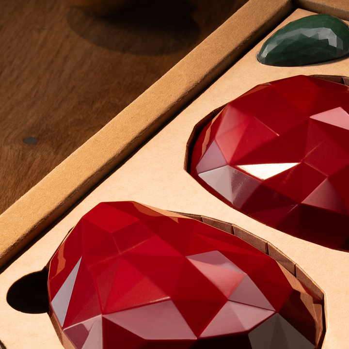 Two Fabergé eggs with garnish