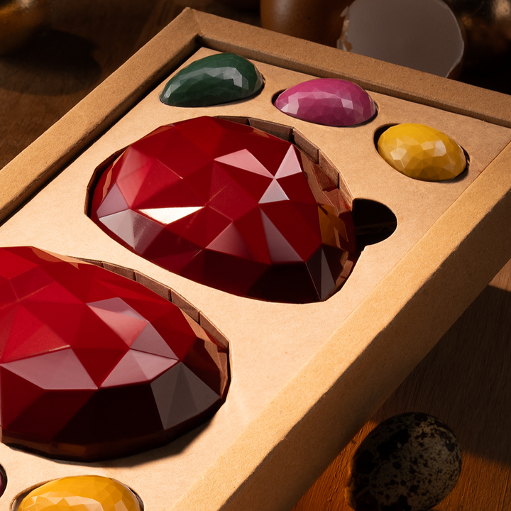 Two Fabergé eggs with garnish