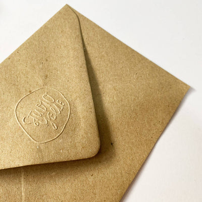 Brown Branded Envelope reads 'Studio Yelle'