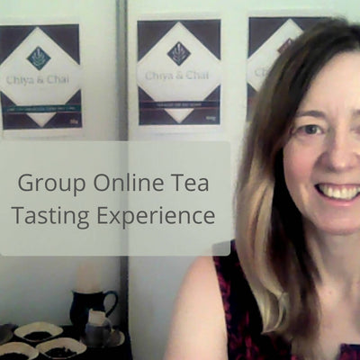 Sandra hosting a tea tasting and smiling at the camera